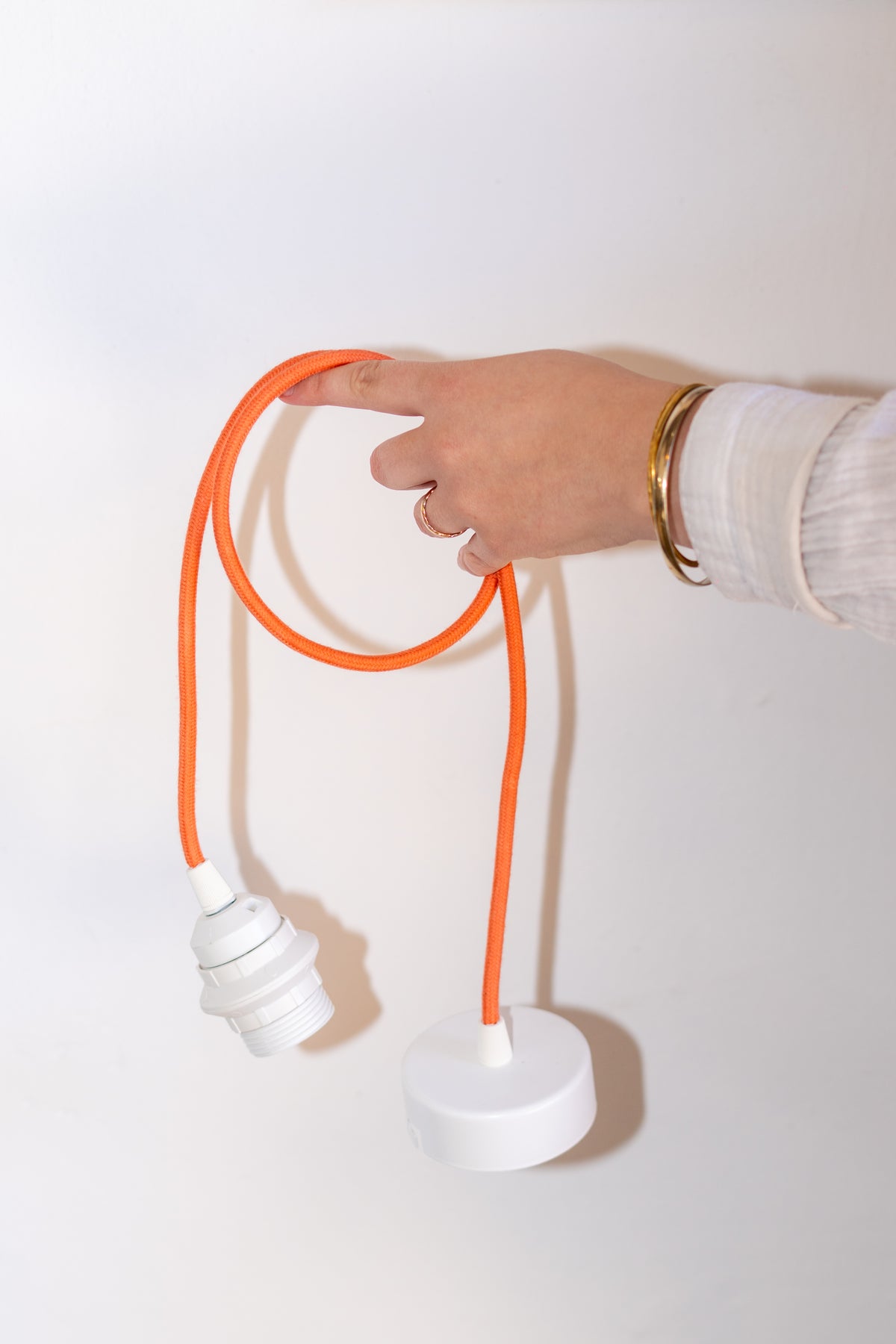 Tangerine orange pendant lamp cord with white fittings