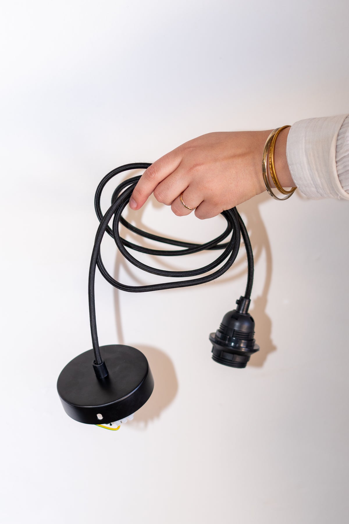 Jet black pendant lamp cord with matching black ceiling canopy and lamp holder